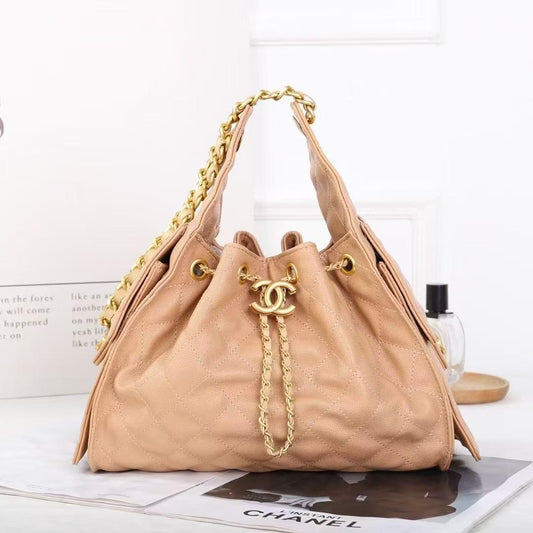 Chanel Gabrielle Drawstring Bucket Bag in Beige Quilted Metallic Calfskin with Gold Hardwa 26 cm